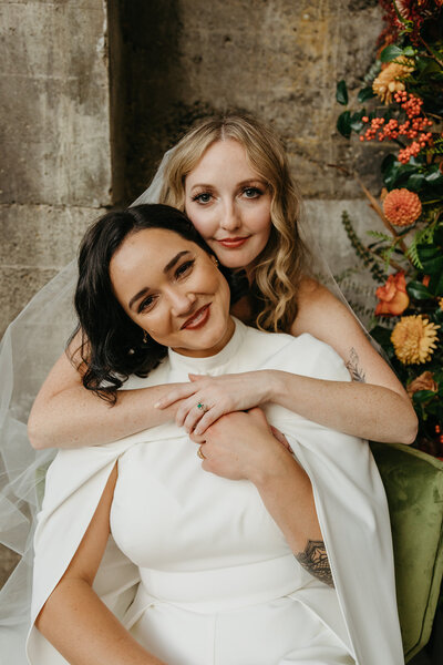 Couple Image in Green Velvet Chair - Megan & Amber | The Ruins PNW Inspired Wedding Hood River Oregon - LGBTQ