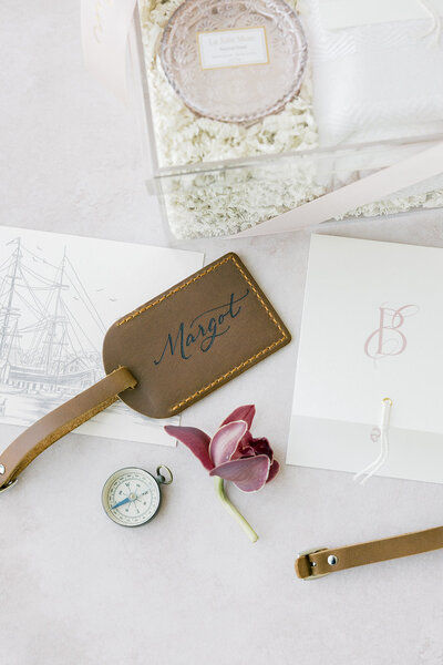 Custom debossed leather luggage tag with calligraphy.