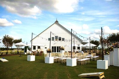White barn with string lights