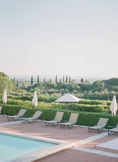 tuscany countryside italy print photo cypress trees pool  blue green umbrellas