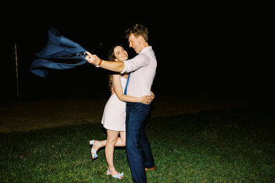 The bride and groom take a moment away from the reception for some flash photography at Paint Rock Farm, by My Sun and Stars Co.