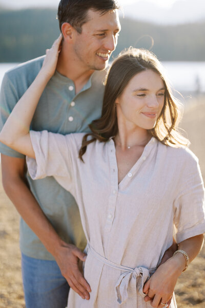 bride and groom in a field