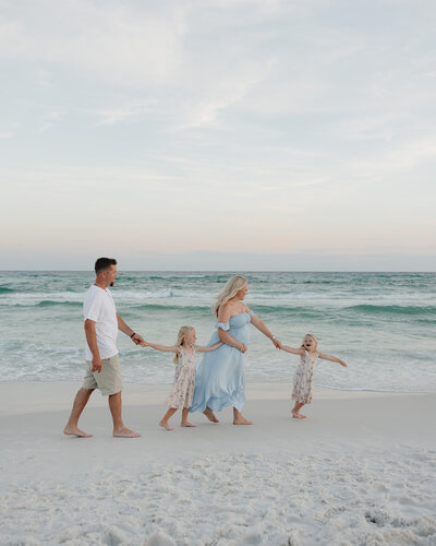 family walks along Rosemary Beach