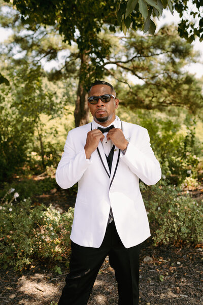 A bride and groom have a dance outside of their churh