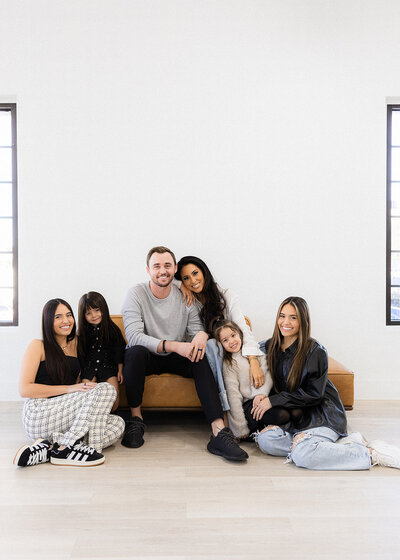 family poses together for family photos in las vegas