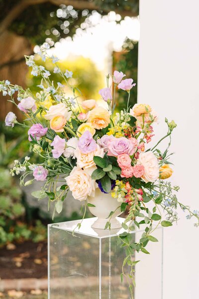 vibrant pastel purple, pink, yellow and cream floral arrangement for a fresno wedding