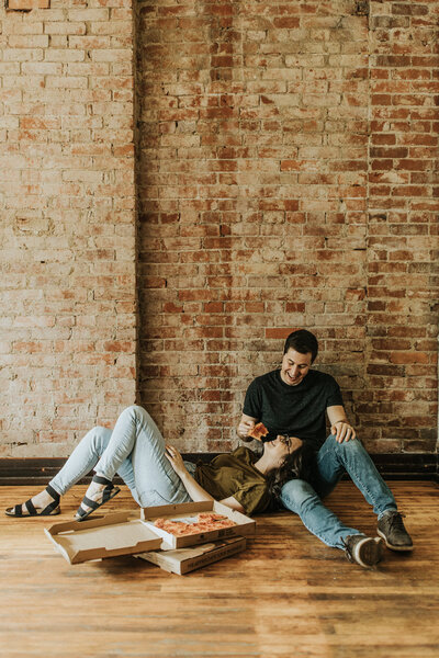 Boho lifestyle photo of couple with cat