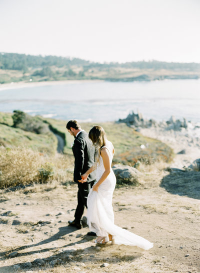 bride and groom elopers walking away on the Big Sur coastline