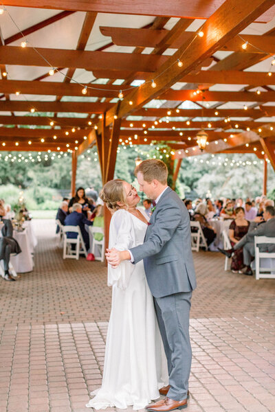 first dance between bride and groom at garden wedding venue
