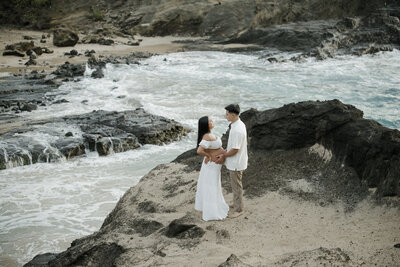 A maternity photoshoot on a beach in Hawaii. cockroach cove, oahu. 