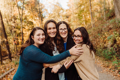Woman holding a baby against her chest