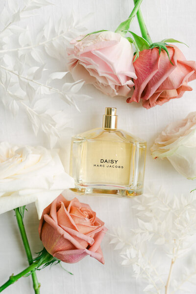 perfume bottle and flower wedding details