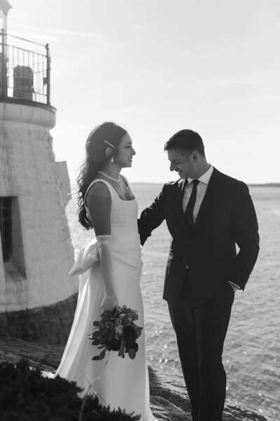 Bride and groom in front of a house in Cape Cod