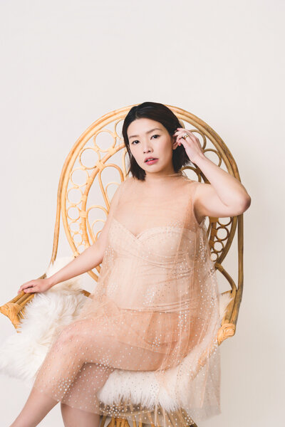 Refined studio maternity portrait — expecting mother in elegant pose, Bay Area