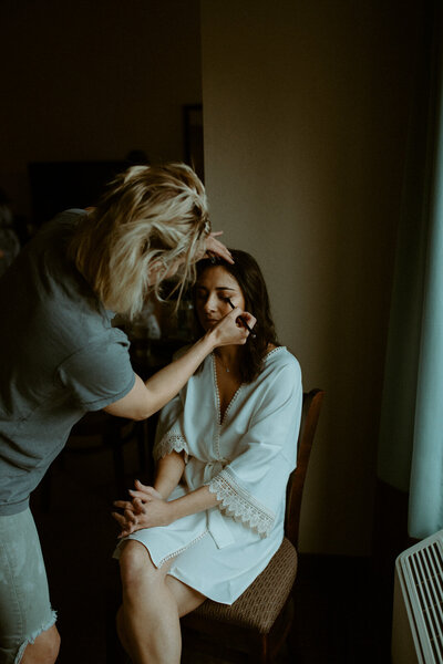 girl getting makeup done