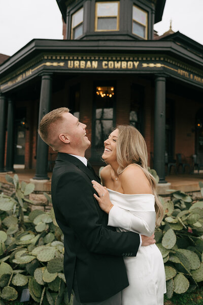 A young bridal couple swing dancing after their morning wedding outside of Austin, Texas. 