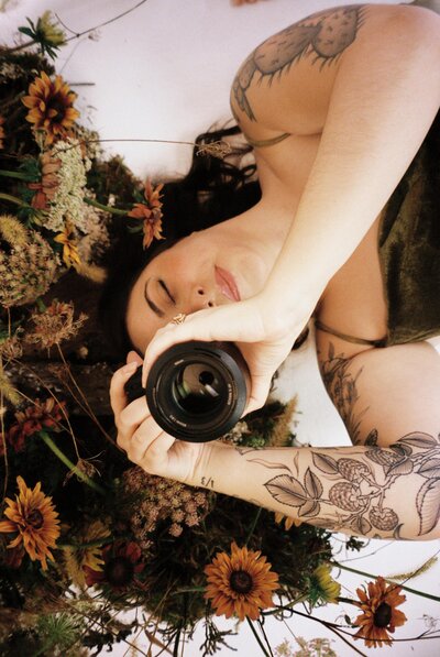 Colleen holds a camera