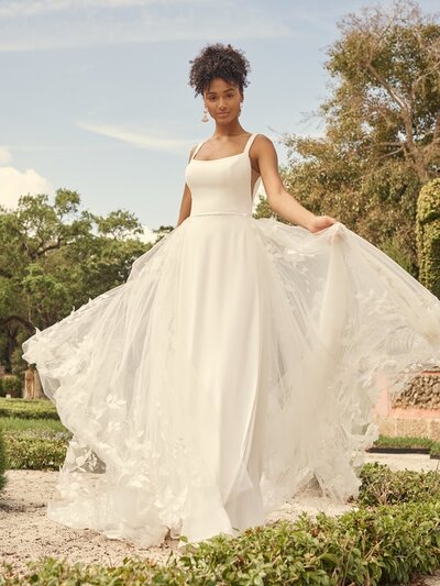 To flip the "ball gown wedding dress" script, one might consider sparkle tulle in tiered layers. Everything else just feels dull in comparison.