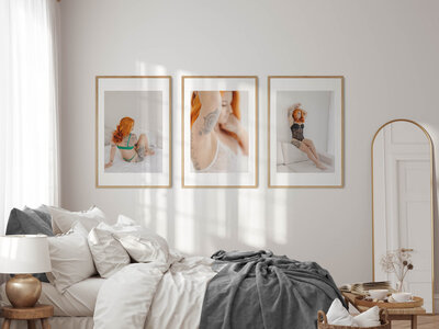 large framed artwork hangs on bedroom of boudoir sesion
