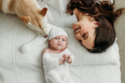 Baby girl with her mom and furry sister during a newborn photoshoot, Palatine, Illinois