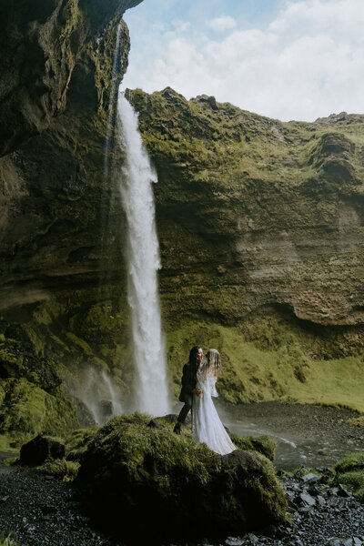iceland waterfall elopement couple kissing