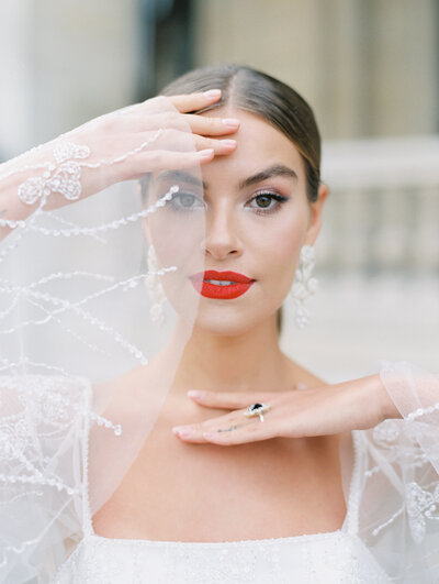 Bride with red lips in Paris