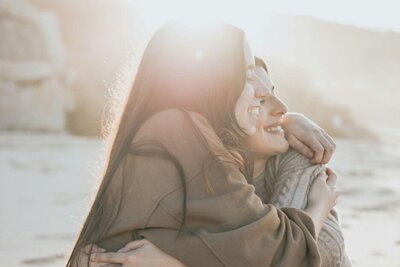 Mother and daughter hugging