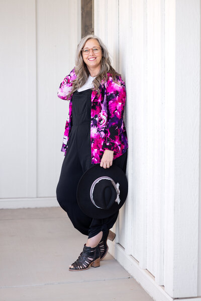 woman in pink floral smiling at camera
