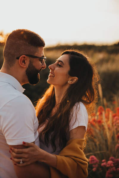 couple embrace in golden light