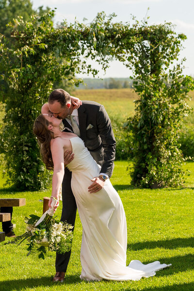 Bride and Groom at Japanese Gardens.  Groom leaning against a tree