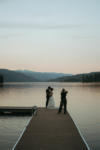 Bride and groom during wedding golden hour portrait session at Payette Lake, McCall, Idaho wedding - photographed by The Storytellers