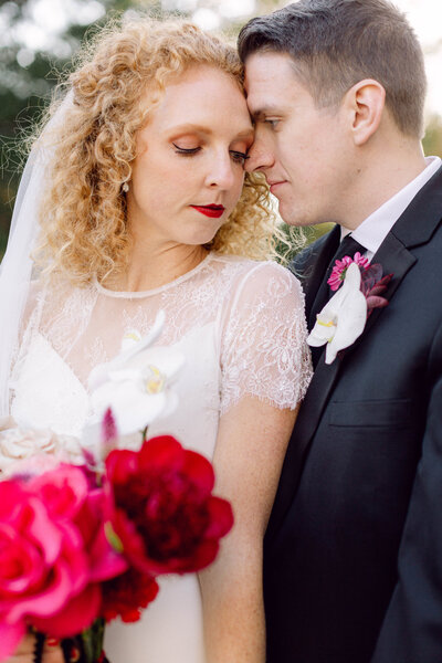 Editorial-style sunset portrait of bride and groom standing together after their intimate backyard wedding in Richmond, Virginia.