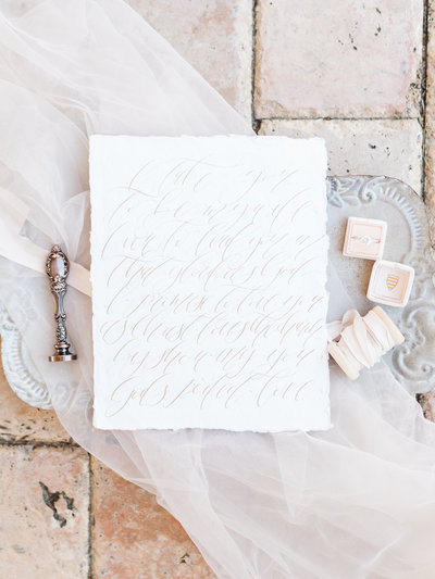 Wedding invitation with calligraphy in light pink