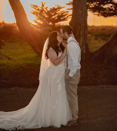 bride putting arms around groom