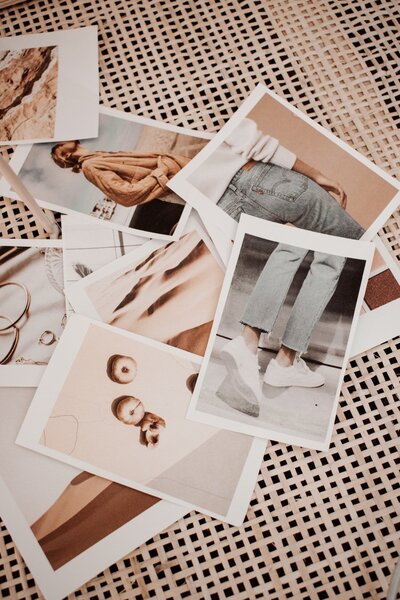 polaroid pictures lying on a boho table