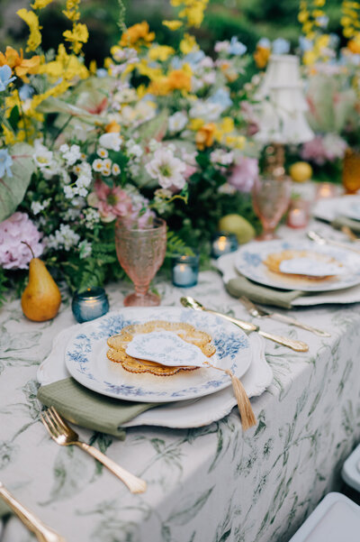 Photo of a green, blue, and yellow tablescape at a wedding at The Simpson House in Kansas City. Photo by KC Wedding Photographer, Anna Brace.