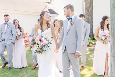 Bride and Groom with bridal party walking and holding hands  | Columbus, GA Wedding Photographer Amanda Horne