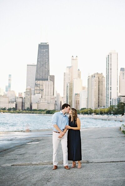 Engaged couple embracing during their engagement session, captured by Milwaukee wedding photographer Emily Barbara in a natural, candid moment
