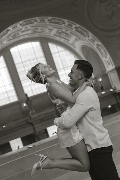 A beautiful stylish modern couple photoshoot at city hall san francisco - make up and hair done by Yana Beauty Studio