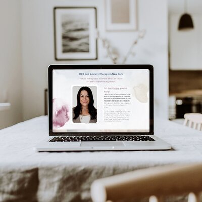 A woman exploring self-care techniques, inspired by Emily Austin's therapy website designed by Unica Formo.