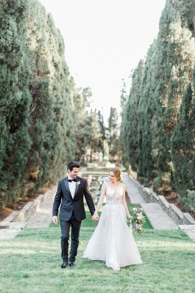 Kohnur couple portrait with bride in natural glowing makeup and romantic updo, wearing a sheer gown in California Estate Wedding