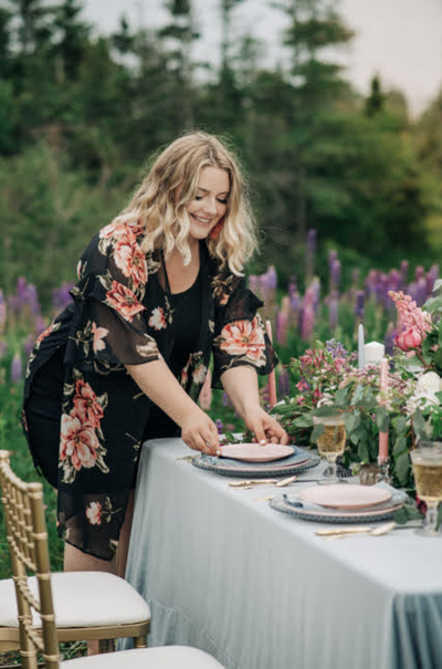 Chris and Amber Photography captured this stunning branded photo of WBS CEO Brittany Bested in a field of lupins