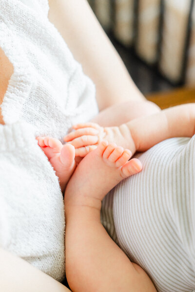 Austin Lifestyle Newborn Photographer | Close-up shot of a newborn baby's feet during an in-home newborn session.