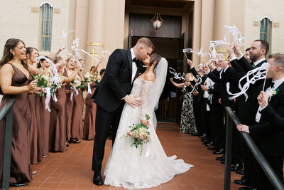 Newlywed bride and groom celebrating their wedding at The Resort at Longboat Key Club in Florida—an elegant and romantic coastal wedding, planned by Watters & Co. Events
