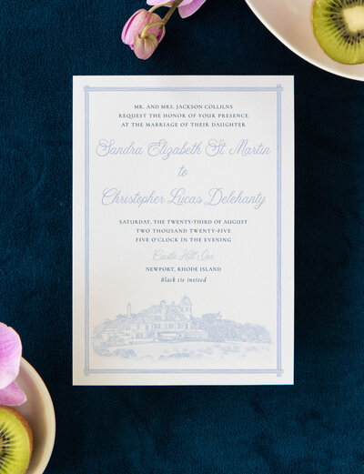 wedding invitation suite featuring line art of coastal wedding venues