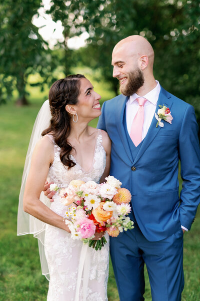 bride and groom looking at each other lovingly, taken by minneapolis wedding photography