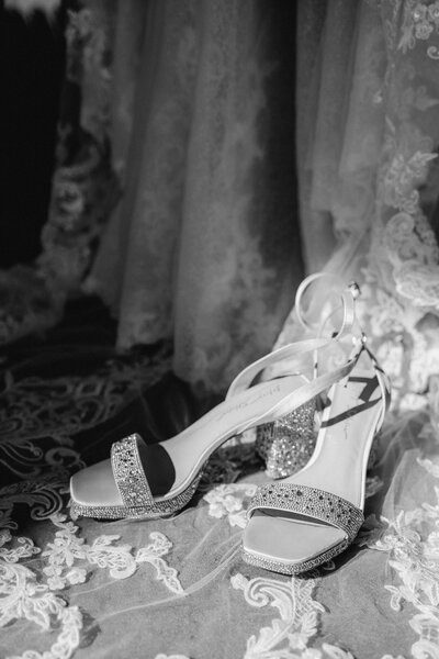 Brides wedding heels in her lace gown