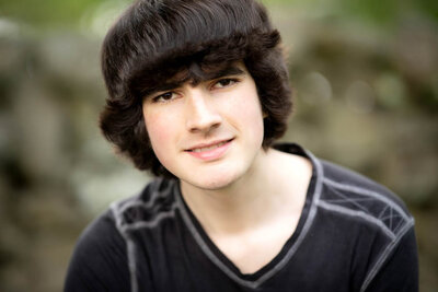 dark haired boy with black shirt