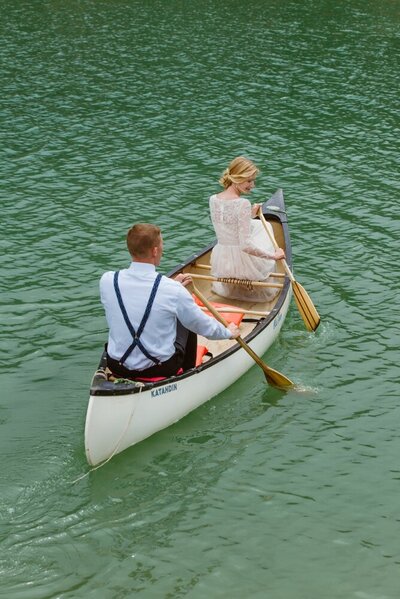 Elopement wedding couple canoes in Telluride lake