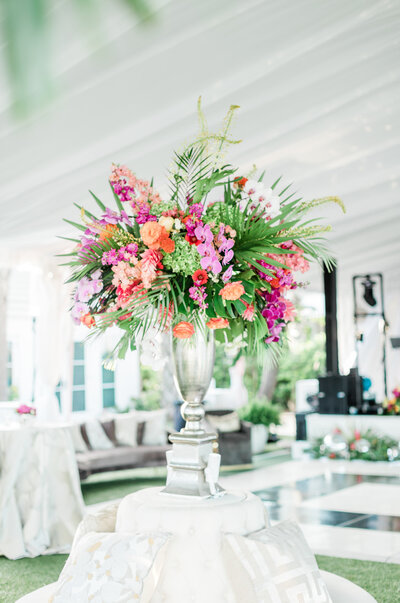 floral and palm centerpiece in florida wedding